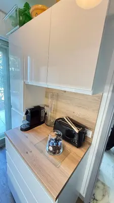 a kitchen counter with a toaster and a bowl of cookies at Studio basse californie cannes in Cannes
