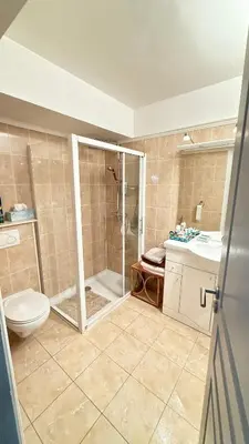 a bathroom with a shower and a toilet and a sink at Studio basse californie cannes in Cannes