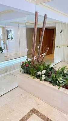 a building with a display of flowers and plants at Studio basse californie cannes in Cannes