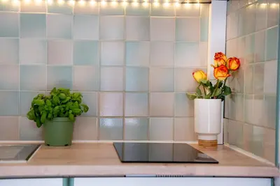 a counter with two vases and flowers on it at Very Quiet Palm Beach Studio Close Beach in Cannes
