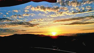 a sunset with the sun setting in the sky at T2 Vue dégagée proche Cannes in Le Cannet