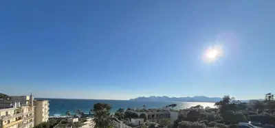 a view of the ocean from a building at Appartement vue & front de mer, piscines, 55M2 2Pièces in Cannes