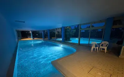 a swimming pool in a building with a view of the city at Appartement vue & front de mer, piscines, 55M2 2Pièces in Cannes