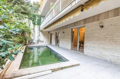a swimming pool in the backyard of a house at Appartement en bord de mer avec piscine - Cannes in Cannes