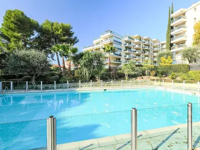 a large swimming pool in front of a building at Studio Le Floriana-2 by Interhome in Cannes