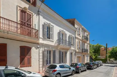 a row of cars parked in front of buildings at Studio Bella - Welkeys in Cannes