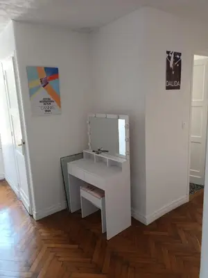 a dressing table with a mirror on a wall at Appartement 2 chambres à Cannes entièrement rénové in Cannes