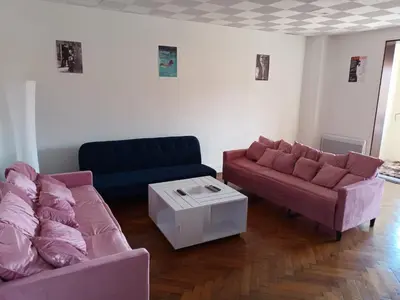 a living room with two couches and a table at Appartement 2 chambres à Cannes entièrement rénové in Cannes