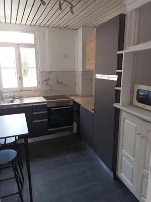 a kitchen with a sink and a stove top oven at Appartement 2 chambres à Cannes entièrement rénové in Cannes