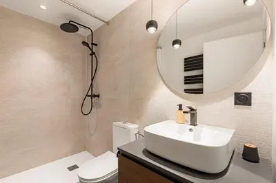 a bathroom with a sink and a mirror at Cèdre Bleu - Chic Peaceful Haven near Croisette in Cannes