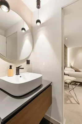 a bathroom with a sink and a mirror at Cèdre Bleu - Chic Peaceful Haven near Croisette in Cannes