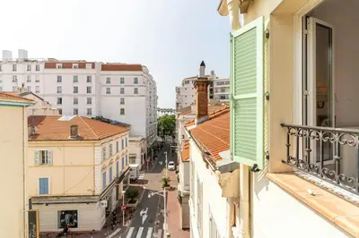 a view of a city street from an apartment balcony at Cannes Centre Le bourbon 1min mer et Croisette in Cannes
