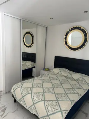 a bedroom with a bed and two mirrors at Cannes Croisette in Cannes