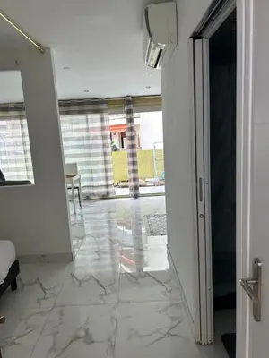 an open door to a room with a tile floor at Cannes Croisette in Cannes