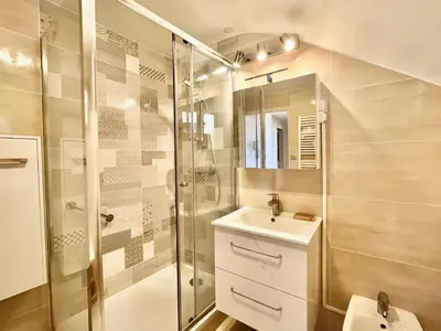 a bathroom with a shower and a sink and a toilet at Belle-epoque apartment ,3bedrooms with sea view in Cannes