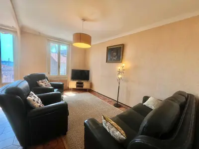 a living room with two couches and a television at Belle-epoque apartment ,3bedrooms with sea view in Cannes