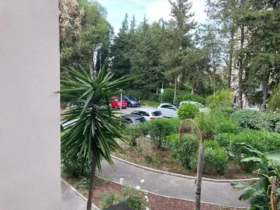 a view of a parking lot with cars parked at Studio neuf parking piscine à Cannes in Cannes