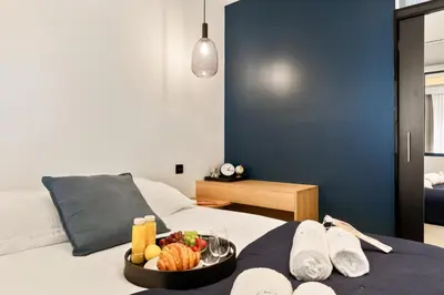 a tray of pastries and fruit on a table at Suite L Ecrin Élégance confort au cœur de Cannes in Cannes