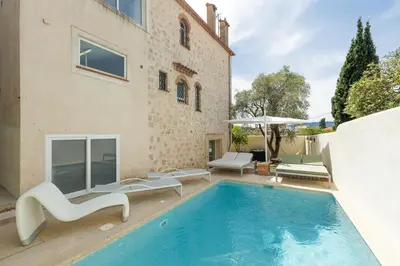 a swimming pool in the backyard of a house at Immogroom - Luxury Villa with Swimming Pool in City Center in Cannes