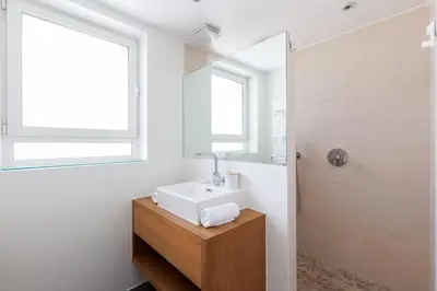 a bathroom with a sink and a mirror at Immogroom - Luxury Villa with Swimming Pool in City Center in Cannes