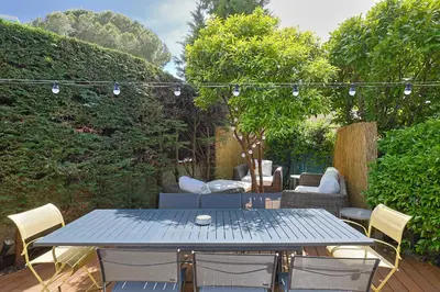 a blue table and chairs on a patio at Immogroom - Luxury Villa with Swimming Pool in City Center in Cannes