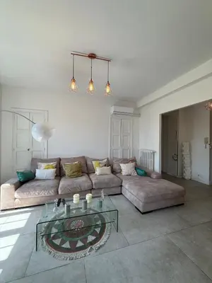 a living room with a couch and a glass table at cannes chill in Cannes