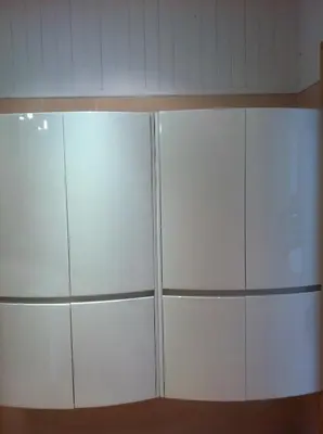 a large white cabinet in a room at villa matama in Cannes