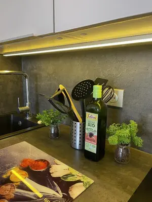 a bottle of sauce sitting on a kitchen counter at Cannes Beach Residence vue mer et pisicne in Cannes