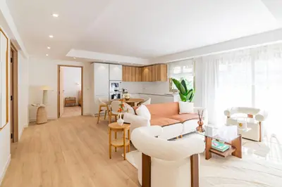 a living room with a couch and a table at REF 2011 - Cannes - Apartment for rent in Cannes