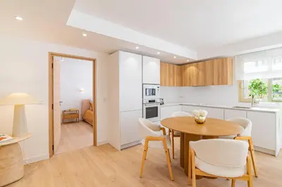 a kitchen and dining room with a table and chairs at REF 2011 - Cannes - Apartment for rent in Cannes