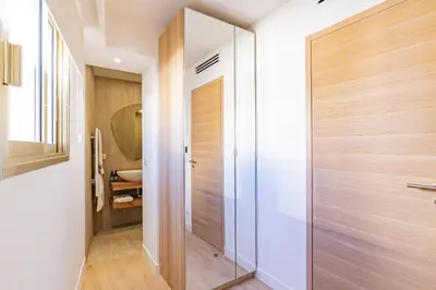 a bathroom with a large glass shower door at REF 2011 - Cannes - Apartment for rent in Cannes