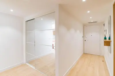 a glass walk in shower in a white room at REF 2011 - Cannes - Apartment for rent in Cannes