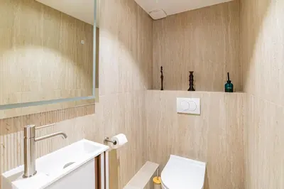 a bathroom with a toilet and a sink at REF 2011 - Cannes - Apartment for rent in Cannes