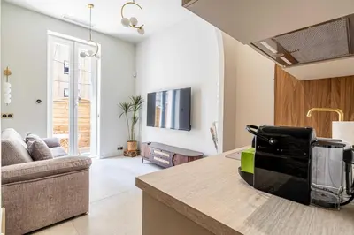 a kitchen and living room with a couch at Magnificent apartment - AC-1BR-4P- Cannes in Cannes