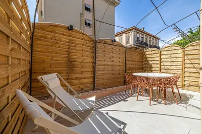 a patio with a table and chairs and a fence at Magnificent apartment - AC-1BR-4P- Cannes in Cannes
