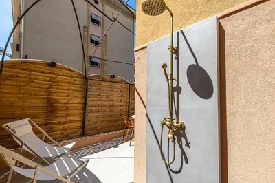 a bathroom with a shower and a chair on a balcony at Magnificent apartment - AC-1BR-4P- Cannes in Cannes