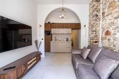 a living room with a couch and a kitchen at Magnificent apartment - AC-1BR-4P- Cannes in Cannes