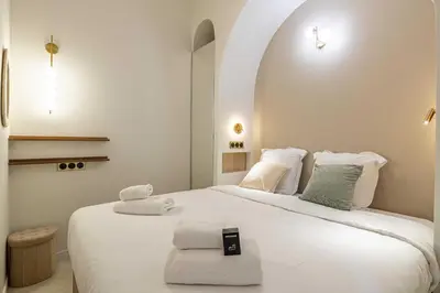 a bedroom with a large white bed with towels on it at Magnificent apartment - AC-1BR-4P- Cannes in Cannes