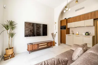 a living room with a couch and a kitchen at Magnificent apartment - AC-1BR-4P- Cannes in Cannes