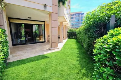 an outside view of a building with a window and plants at Beachfront 4 - 6 people 2 swimming pool in Cannes