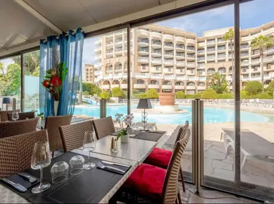 a bathroom with a shower with purple lights at Beachfront 4 - 6 people 2 swimming pool in Cannes