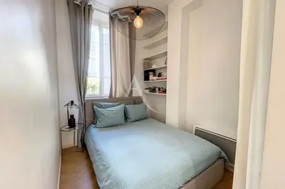 a small room with a bed in front of a window at Le Barocco - Calm - Hypercentre - Cosy in Cannes