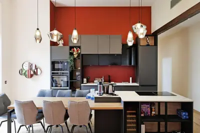 a kitchen with a table and chairs in a room at RARE-Superbe appt Suquet, jardin,6p,200m Croisette in Cannes