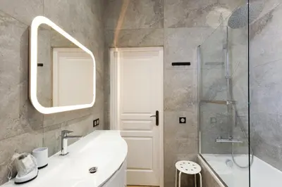 a bathroom with a sink and a mirror and a shower at RARE-Superbe appt Suquet, jardin,6p,200m Croisette in Cannes