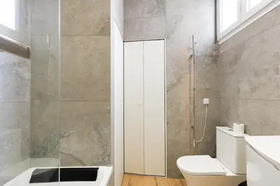 a bathroom with a toilet and a glass shower at RARE-Superbe appt Suquet, jardin,6p,200m Croisette in Cannes