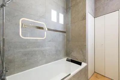 a bathroom with a white bath tub in a room at RARE-Superbe appt Suquet, jardin,6p,200m Croisette in Cannes