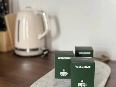 three green boxes sitting on a counter next to a toaster at C023 Magnifique appartement 3 chambres dans Cannes in Cannes