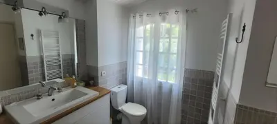 a bathroom with a sink and a toilet and a window at Villa Olimp in Super Cannes with sea view in Le Cannet