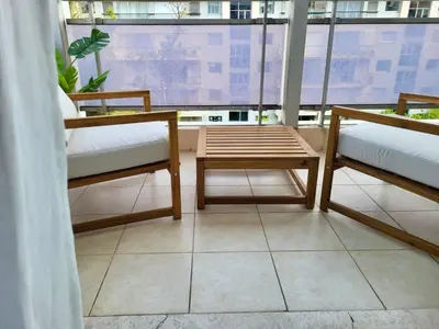 a room with two benches and a table and a window at Cannes Eden By SCLS Locations in Cannes