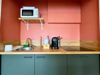 a kitchen counter with a sink and a microwave at Cannes Eden By SCLS Locations in Cannes